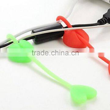 customized shape and logo soft pvc rubber dog bone shape silicone earphone cable winder