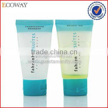 Translucent shampoo and shower gel tube with blue flip cap