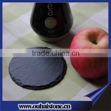 Circular slate coaster with logo