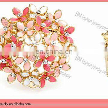 gold enamel metal flower brooch jewelry