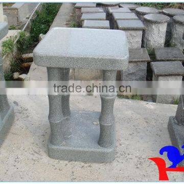 small bamboo style stone chair