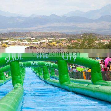 Guangzhou high quality manufacturer giant inflatable water slide long slide for kids and adults