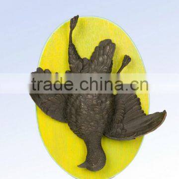 large bronze wall bird relief sculpture