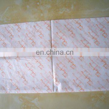 White tissue paper with orange logo