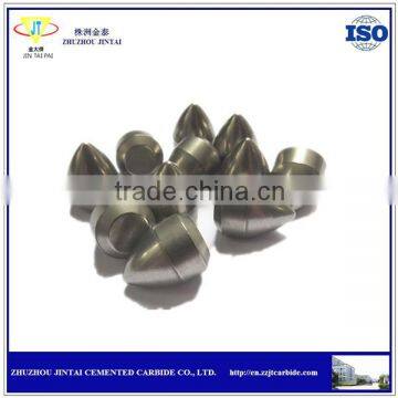 Grinding tungsten carbide buttons