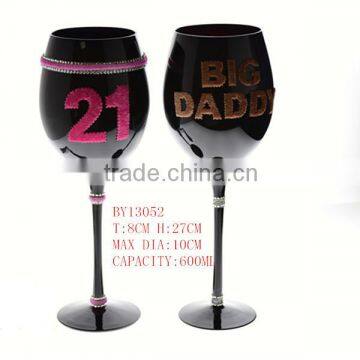 mouth blown black wine glass with decoration