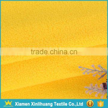 High Quality Weft Knitted Lightweight Yellow Polar Fleece Fabric photo-4