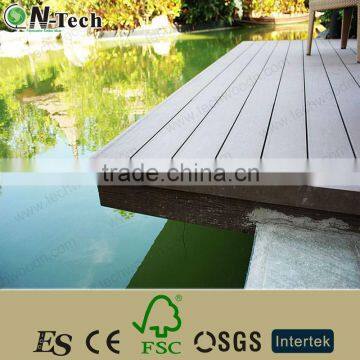 Solid composite patio decking boards