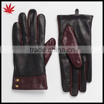 Ladies smart phone wearing leather gloves with cuff detail