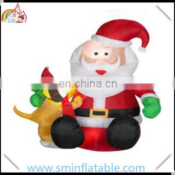 Hot selling pvc led lighting inflatable santa claus sitting with dog for christmas decoration