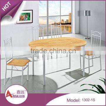 Dining room simple design cheap long 130cm oval wood pvc vintage dining table with 4 chairs