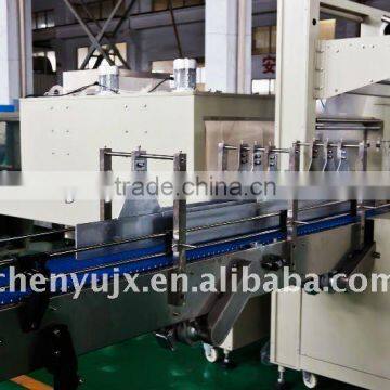 Automatic shrink film wrapping machine