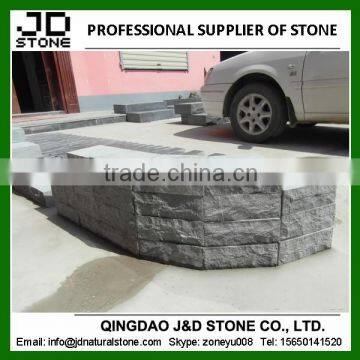 Natural split bluestone brick wall