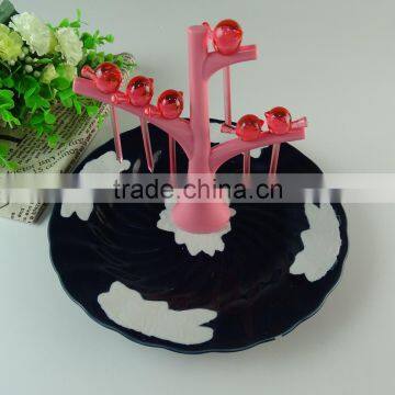 Bulk stock cheap black glazed round porcelain fruit plate with plastic stick wholesale