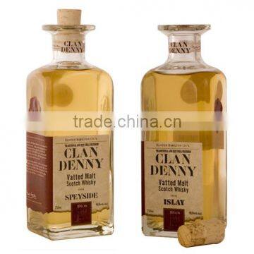 round empty glass whisky bottles