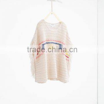 KNIT EMBROIDERED PONCHO Closed poncho with fringed sleeves and embroidered bands