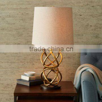 11.23-5 geometry-inspired base Rings intersect Brass beauty Geodesic Table Lamp add a warm glow beside sofas and chairs