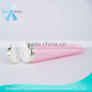 Plastic cosmetic tube with flip-top cap