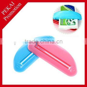 Plastic toothpaste squeezer