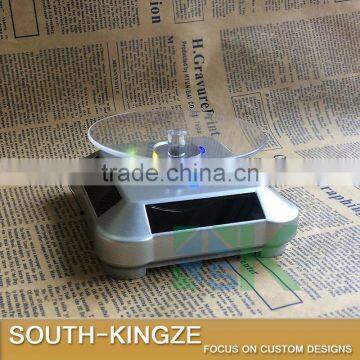 Silver Acrylic Watch/Jewelry/Camera Solar Power Rotating Display Stand photo-3