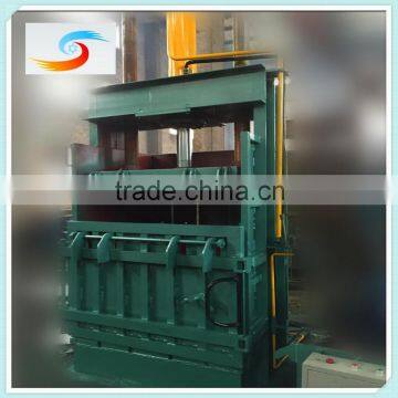 Manual strapping vertical waste paper baler