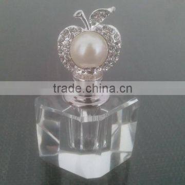 small empty perfume bottle with apple top