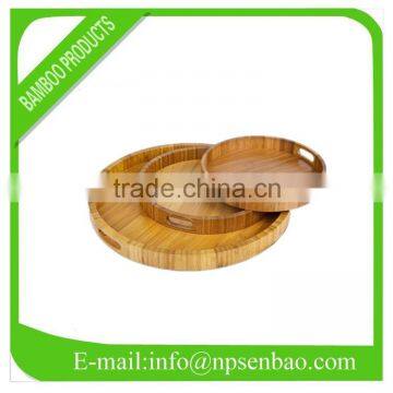 round bamboo serving tray with a handle