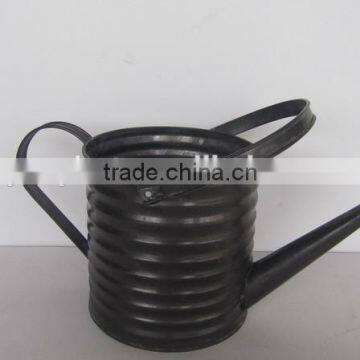 black metal watering can