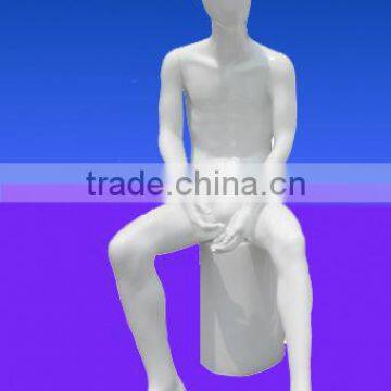 Hot sitting male mannequin