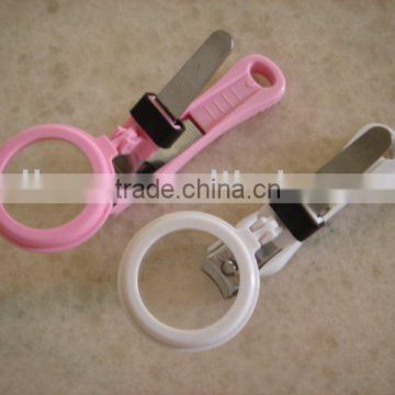 Nail clipper with magnifier