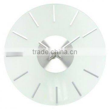 Glass wall clock with metal figures