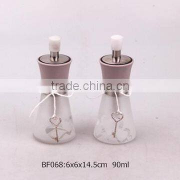 glass spice jar with metal lid and 'heart' frosted and 'key' hangtag