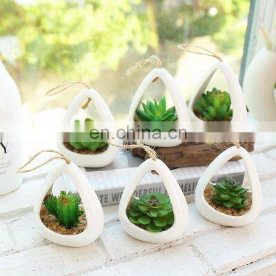 Wholesale White Ceramic Hanging Planters Flower Pot Faux Succulent Plant Pot Artificial Plant Wall Hanging Pot With Hemp Rope