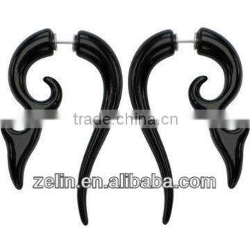 A fake spiral ear rings stretchers in black acrylic body jewelry