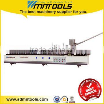 Wood profile wrapping machine