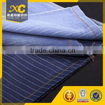 Indigo cotton polyester denim fabric with jacquard pattern