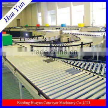 Roller Conveyor System With Powered Lift Section To Raise And Lower Parts