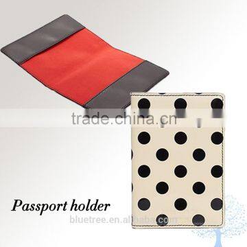 branded passport wallet in black dots pattern