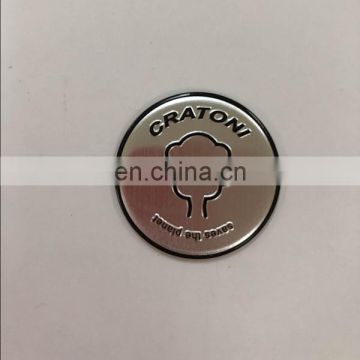 Round cap labels embossed alloy logo