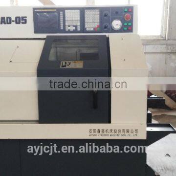 Gang type CNC lathe