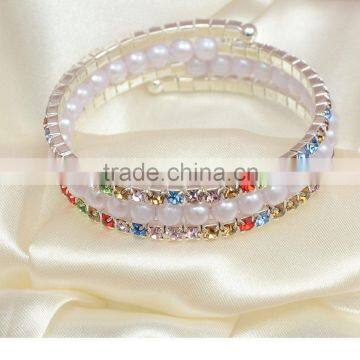 Three rows crystal and rhinestone graduated wraparound coil bracelet