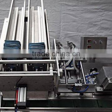 China Guangzhou GMP Standard Double Head Face Mask Making Machine photo-3