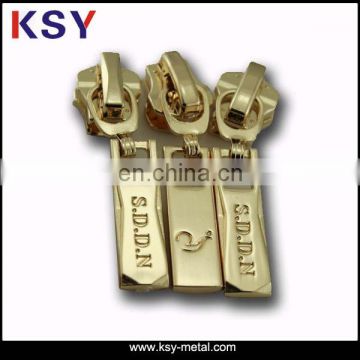 Factory direct metal zipper pull with raised logo on front and back