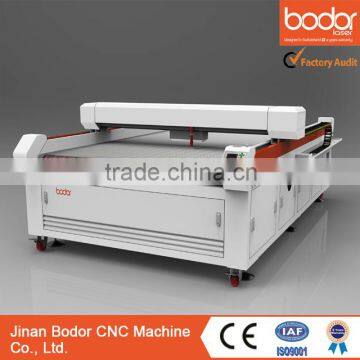 CO2 AUTO-FEEDING laser cutting machine bed with 2 years warranty