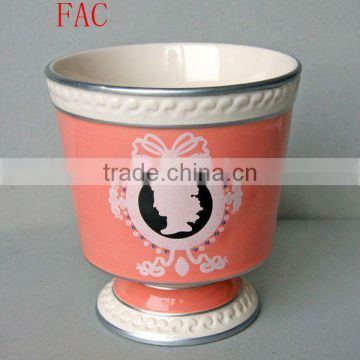 Stock ceramic flower pot in pink color round shape