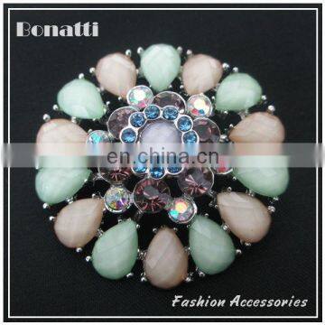 round layered crystal brooch