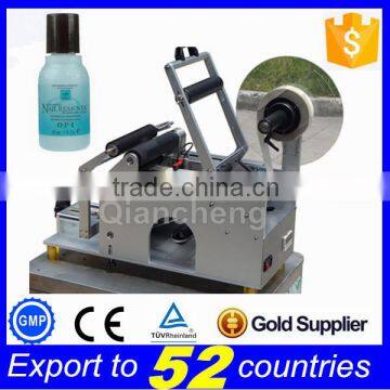 PLC Controlled manual bottle labeling machine,transparent label labeling machine