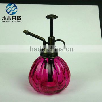 Pink colored pumpkin shaped small garden watering sprayer bottle