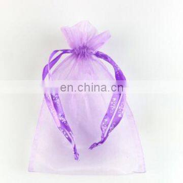 Purple organza bag with white printed ribbon