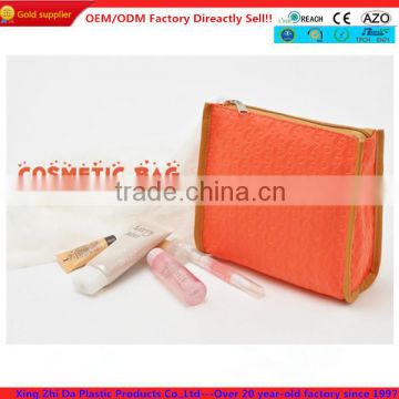 Embossed orange PU cosmetic packaging pouches